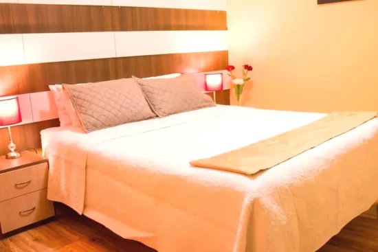 Cama de la habitación Serk'ana Suite Hostal Arequipa