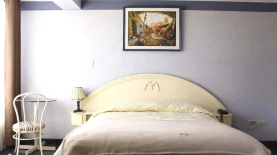 Cama de la Suite Hotel Mediterraneo Arequipa