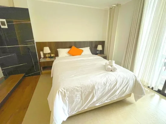 Cama de la suite Hotel QC Trujillo